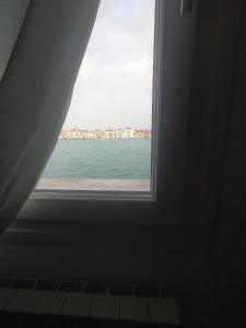 a window view of the ocean from a room at Cà Isabella in Venice