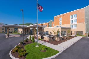 a building with an american flag in front of it at SpringHill Suites by Marriott Fishkill in Fishkill