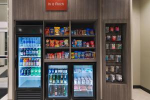 a store with two refrigerators with drinks and soda at TownePlace Suites by Marriott Dallas DFW Airport North/Irving in Irving
