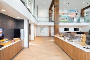 a lobby of a building with a reception counter at Fairfield by Marriott Inn & Suites Franklin Cool Springs in Franklin