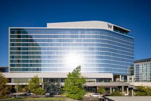 a large glass building with a w companies sign on it at W Nashville in Nashville