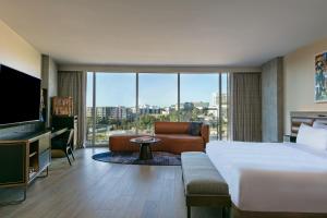 a hotel room with a bed and a large window at W Nashville in Nashville