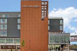 a building with a sign on the side of it at SpringHill Suites by Marriott Albuquerque University Area in Albuquerque