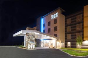 a rendering of the front of a hotel at night at Fairfield Inn & Suites by Marriott Fort Morgan in Fort Morgan