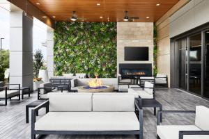 a lobby with a large wall of flowers at AC Hotel by Marriott Bridgewater in Bridgewater