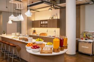 a counter with fruits and drinks on it in a kitchen at Element Moline in Moline