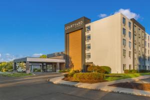 a rendering of the front of a hotel at Courtyard Rockaway-Mount Arlington in Mount Arlington