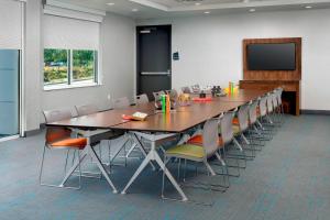 a conference room with a long table and chairs at Aloft Atlanta at The Battery Atlanta in Atlanta