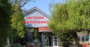 a building with a sign that reads uptown residence at Motel Vega in Sezimovo Ústí