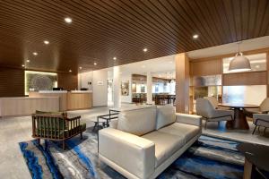 a living room with a couch and a table at Fairfield Inn & Suites by Marriott Chicago Bolingbrook in Bolingbrook