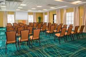 a room with a bunch of chairs in it at SpringHill Suites Prince Frederick in Prince Frederick