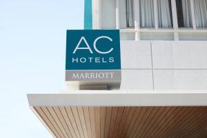 a sign on top of a building with aac hotels marriott at AC Hotel by Marriott Beverly Hills in Los Angeles