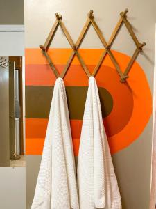 a bathroom with white towels hanging on a rack at Cozy Retreat Just Minutes From Beech Mountain in Beech Mountain