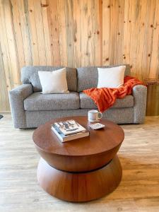 a living room with a couch and a coffee table at Cozy Retreat Just Minutes From Beech Mountain in Beech Mountain