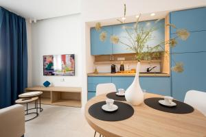 a kitchen and dining room with a table and chairs at Giada Luxury Terrasini in Terrasini