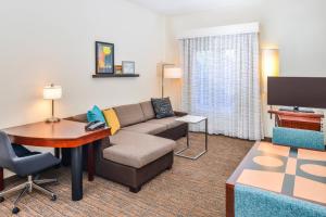 a living room with a couch and a table at Residence Inn Waynesboro in Waynesboro