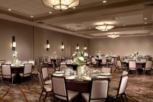 a banquet room with tables and chairs and candles at Marriott Raleigh Durham Research Triangle Park in Durham
