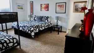 a bedroom with two beds and two tables with lamps at Garden Retreat-river Trail, Slc, Big Rooms,views in Riverton
