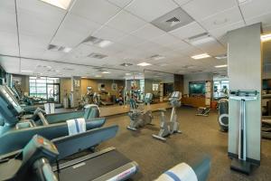 a gym with rows of treadmills and machines at Richmond Marriott Short Pump in Short Pump