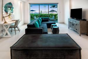 a living room with a couch and a table at The Ocean Club, a Luxury Collection Resort, Costa Norte in Sosúa