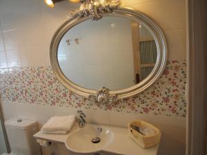 a bathroom with a sink and a mirror on the wall at El Rincón de Escalante in Escalante +50 photos