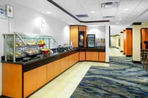 a buffet line in a hotel room with food at Fairfield Inn & Suites Milledgeville in Milledgeville
