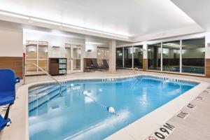 a large swimming pool with blue water at Fairfield Inn & Suites by Marriott Goshen in Goshen