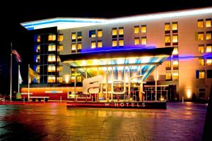 a hotel building with a sign in front of it at Aloft Mount Laurel in Mount Laurel