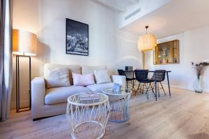 a living room with a couch and a table at Samaritana Suites in Palma de Mallorca