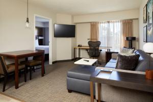 a living room with a couch and a table at Residence Inn San Diego Carlsbad in Carlsbad