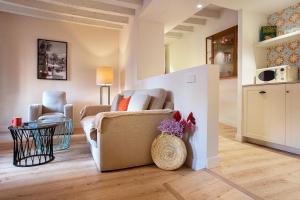 a living room with a couch and a chair at Samaritana Suites in Palma de Mallorca