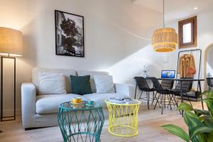 a living room with a couch and a table at Samaritana Suites in Palma de Mallorca
