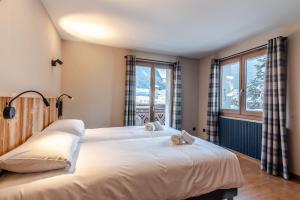 Posteľ alebo postele v izbe v ubytovaní CHALET CLAUDETTE + 4 fotografie