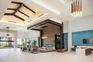 an open lobby with a couch and chairs at Sheraton Carlsbad Resort & Spa in Carlsbad