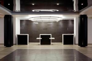 a large room with black walls and a chandelier at Delta Hotels by Marriott Trois Rivieres Conference Centre in Trois-Rivières