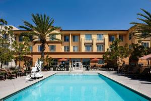 a hotel with a swimming pool in front of a building at Residence Inn by Marriott San Juan Capistrano in San Juan Capistrano