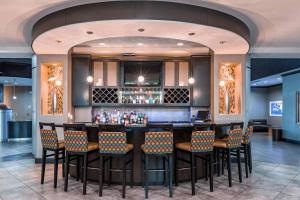 a bar in a restaurant with chairs and a counter at SpringHill Suites by Marriott Waco Woodway in Woodway