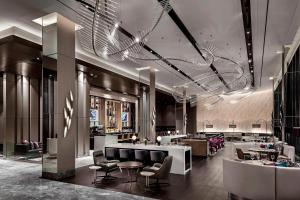 a hotel lobby with a bar and a restaurant at Toronto Marriott Markham in Markham