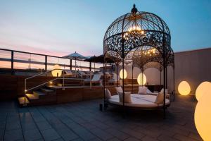 a gazebo sitting on the roof of a building at Kameha Grand Zurich, Autograph Collection in Glattbrugg