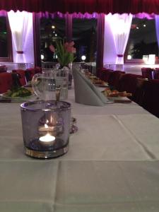 a table in a restaurant with plates of food at Eckerö Hotell & Restaurang in Eckerö
