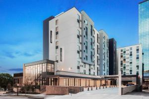 a rendering of a white building with tall buildings at Residence Inn by Marriott Knoxville Downtown in Knoxville