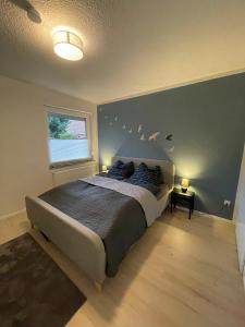 Postel nebo postele na pokoji v ubytování Ferienwohnung Mühlenwarf