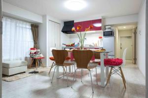 a kitchen and dining room with a table and chairs at Asakusa 2 Bedroom Apartment 西浅草2LDK広々ファミリーorグループ in Tokyo
