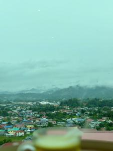 a view of a city with houses and mountains at Blest Loft 7 Manhattan Suites ITCC in Penampang