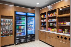 a store with two refrigerators in a grocery store at SpringHill Suites By Marriott Durham City View in Durham