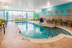 a swimming pool with a child in the middle at SpringHill Suites by Marriott Chambersburg in Chambersburg