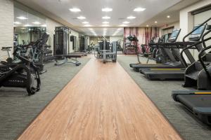 a fitness room with treadmills and exercise machines at Courtyard by Marriott Houston Northeast in Houston