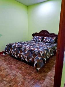 a bedroom with a bed in a room at Teacher House in Phra Ae beach