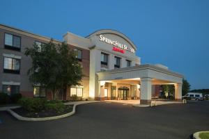 a building with a sign on the front of it at SpringHill Suites Quakertown Pennsylvania in Quakertown