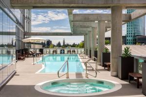 a swimming pool on the roof of a building at Civic Hotel, Autograph Collection in Surrey